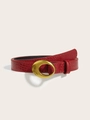 Detail of red faux crocodile leather belt with vintage oval gold metal buckle - Burgundy
