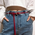 Slim burgundy leather belt for women with golden oval buckle on blue jeans - Red