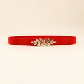 Dettaglio della cintura elastica rossa con fibbia decorativa a foglia dorata - 65cm / Rosso