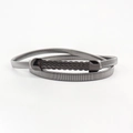 Detail view of gun-black metal spring belt showing wave-textured buckle and fine coil structure - Gun Black