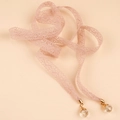 Detail of pink lace ribbon belt featuring golden metal ends and clear teardrop crystal charms - Pink Lace Style