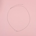 Macro detail of silver heart pendant chain on a pink background for beach waist wear - Hollow Heart Style (006) / Silver
