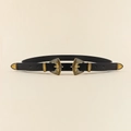 Détail de la double boucle dorée vintage sur une ceinture fine noire de style punk rétro - Style Ceinture Or