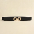 Detail of black elastic waist belt featuring a polished gold interlocking ring buckle - Black