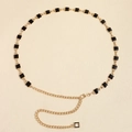 Dettaglio catena in vita dorata con quadrati in smalto nero e chiusura a moschettone regolabile - Double-face bianco e nero
