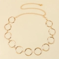 Detailed macro view of the gold adjustable metal waist chain belt with large round rings - S / Gold