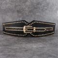 Detail of a black punk corset belt featuring gold studs and a metallic buckle closure - Black