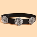 Close-up of vintage black leather belt with three silver metallic rose decorations - Black