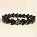 Close-up of vintage black leather belt with silver star buckle and triangular studs - Black