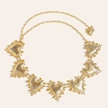 Macro detail of gold vintage heart waist chain belt with textured metallic heart charms - Gold