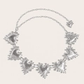 Detailed view of silver heart charms with lava texture and beaded edges on metal waist chain - Silver