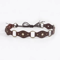 Dettaglio cintura intrecciata in pelle marrone scuro con anelli in bronzo e rivetti - Bronzo Rosso Marrone