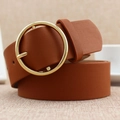 Caramel brown leather belt for women featuring a large circular polished gold metal buckle - Camel