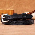 Women's slim black leather belt featuring floral embossing and a silver metal buckle - Black