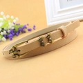 Elegante cintura sottile beige con fibbia a fiocco in bronzo vintage da donna - Nudo