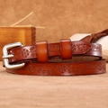 Vintage brown leather belt with embossed floral patterns and silver metal buckle - Camel