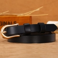 Slim black genuine leather belt for women featuring a gold horseshoe buckle and fine texture - Black