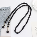 Elegante cintura elastica in perle nere con accenti dorati e cristalli scintillanti - Nero
