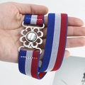 Red, white, and blue striped elastic belt with a silver flower-shaped metal buckle - Red White and Blue (EL231)