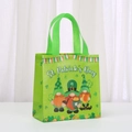 Close-up of St. Patrick's Day non-woven gift bag with green gnome print and handles - Three Leprechaun Gnomes Style (9025-8)
