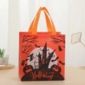 Detail of Halloween non-woven gift bag with witch, castle and pumpkin prints in orange - Orange Black Witch Castle Style (5007-6)