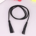 Minimalist black woven waist belt for women featuring decorative long fringe tassels - Black