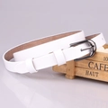 Women's white leather belt with polished horsehoe buckle on a minimalist background - White