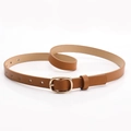 Slim brown leather belt for women with a polished gold oval buckle on white background - Camel