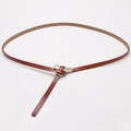 Elegant reddish brown leather slim waist belt with a silver buckle in a knotted style - Camel