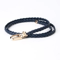 Slim braided belt in navy blue faux leather with a polished gold horseshoe buckle clasp - Navy Blue
