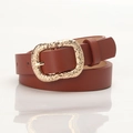 Women's vintage brown belt with a decorative floral engraved golden buckle detail - Camel