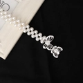 Elegante doppelreihige Perlen-Taillenkette mit silbernen Schmetterlingsschnallen und Strasssteinen - Hohler Doppel-Schmetterling Stil (8134)