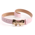 Pink PU leather belt for women featuring a shiny gold metal bow buckle and adjustable holes - Pink