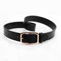 Minimalist black leather belt for women featuring a polished gold-tone pin buckle - Black
