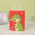 Dettaglio del sacchetto regalo rosso con dinosauro verde e manici in corda bianca - Stile Dinosauro Rosso / 21x15x8cm