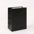 Minimalist black paper gift bag with matte finish and black nylon woven handles - Black
