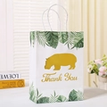 Detail of white kraft gift bag with tropical leaves, golden hippo, and Thank You text - Hippo Thank You (120-6反面)