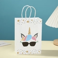 White unicorn gift bag with gold foil horn and colorful stars for birthday party - Cool Sunglasses Unicorn (403-4)