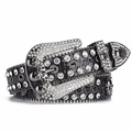 Detailed macro of punk rock leather belt with rhinestone skull buckle and silver studs - Black