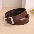 Classic dark brown leather belt with silver metal buckle displayed on a wooden surface - Coffee / 110cm