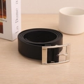 Detail showing flexible black leather belt texture with polished silver metal pin buckle - Black / 110cm