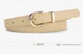 Detailed close-up of a beige faux leather skinny belt with a gold D-shaped metal buckle - Beige / 105*1.8