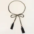 Detail of woven black and gold waist chain with silk tassels and golden metallic beads - Black