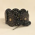 Detail view of Bohemian rivet belt with bronze studs and circular leather patchwork design - Bronze Black