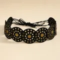 Detail of bohemian belt featuring black leather discs and embossed sun flower rivets - Bronze Black
