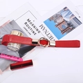 Fashionable red elastic waist belt with gold double-ring buckle for women on stylish desk - Red