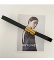 Detail of a thin black leather belt with a minimalist cylindrical gold metal buckle - Black