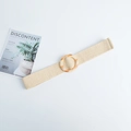 Detailed macro view of beige straw woven belt with round amber-textured resin buckle - Acrylic Round Buckle Beige