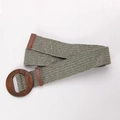 Detail view of ethnic green straw woven waist belt with a round wooden buckle - Oval Wood Buckle Green