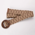 Detail of bohemian woven belt featuring beige patterns and a large round wooden buckle - Striped With Oval Wood Buckle